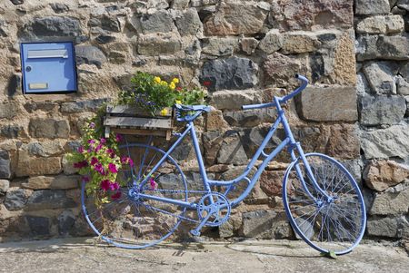 Blue bike in front of house in Franceの写真素材