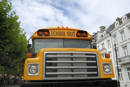 Yellow schoolbus in a city