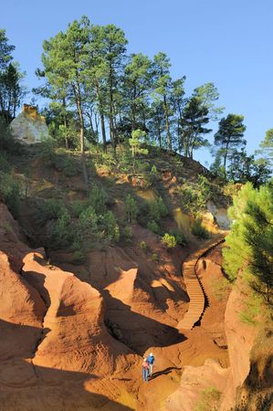 This picture was taken just as the sun was setting in Rousillon, France during late summer. It captures the red ochre, which is mined in Roussillon.の写真素材
