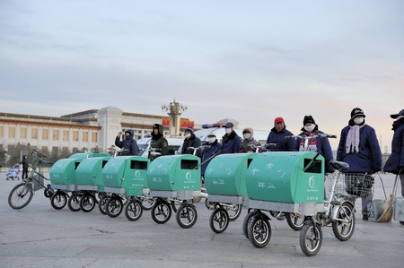 BEIJING,CHINA-December 13, 2010; Street cleaners and their cars standing in a row at Tiananmen Square while the flag is going down. のeditorial素材