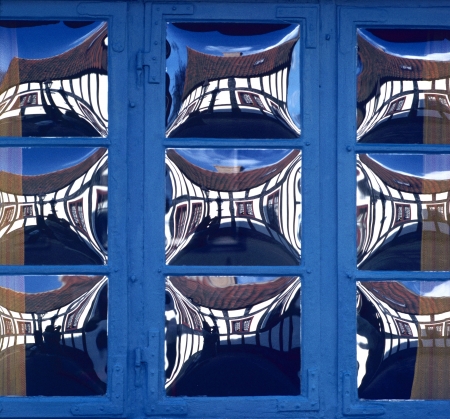 Reflections in special windows of old dyeworks houses at Ebeltoft, Denmark.
Grained filmfilter added. の写真素材