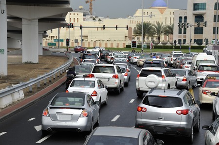 Dubai, United Arab Emirates - February 9, 2014  Traffic on highway leading to the city center  During rush hour all highways and main roads are full with traffic  February 9, 2014 Dubai, United Arab Emiratesの写真素材