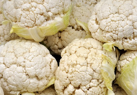 cauliflowers at the greengrocer at a farmers market の写真素材