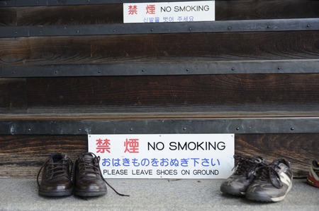 At the entrance of a temple in Japan you are requested to leave your shoes outside and do not smokeのeditorial素材