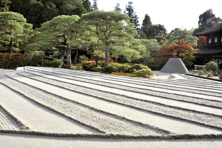 Kyoto,Japan-November 10, 2014; Zen garden with sand tower named Kogetsudai, representing fuji montain.November 10, 2014, Kyoto, Japanのeditorial素材