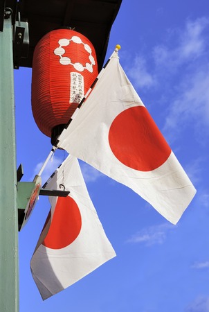 Japanese flags and Japanese lampion agianst clear blue sky