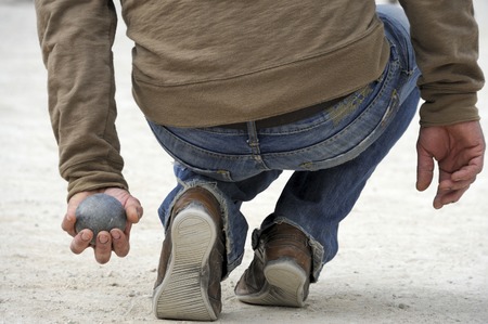 Playing jeu de boules or also called petanque in France. This play is played at street in every village of France.の写真素材