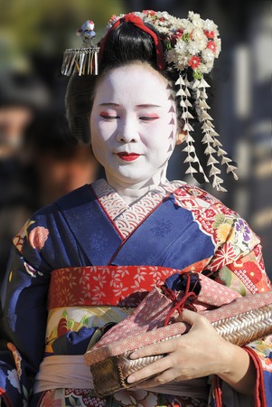 KYOTO, JAPAN - NOVEMBER 4, 2014: Geisha woman in traditional dress. Kyoto is center of Japan's traditional culture. Kyoto has 17 Unesco World Heritage Sites and is one of the world's most culturally rich cities and is the capital of the geisha world. Theyのeditorial素材