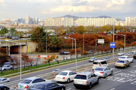 Seoul, South Korea-November 12, 2015; Traffic on a highway leading to the city center. During rush hour all highways and main roads are full with traffic. At the background the Seoul Tower.November 12, 2015 Seoul,South Koreaのeditorial素材