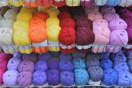 Balls of knitting wool on display in a haberdashery store.の写真素材