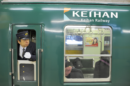 KYOTO, JAPAN - NOVEMBER 04, 2014: Railway guard at Keihan Railway Station in Kyoto, Japan. Keihan Railway company was founded in 1949 and is among busiest in Japan.のeditorial素材
