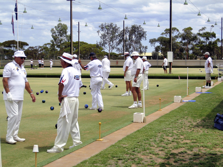 Playing bowls. Group of elderly people bowling on a bowling green in Australiaのeditorial素材