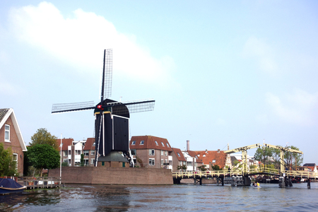 Wooden Rembrandt drawbridge and the 17th century post millの写真素材