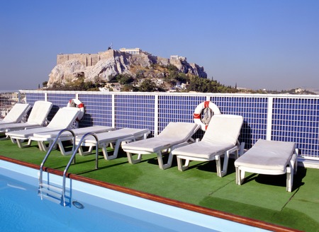 ATHENS, GREECE-MAY 12, 2015: Acropolis in Athens; in front swimming pool at hotel roof. The Acroplois site is an UNESCO World Heritage landmark.のeditorial素材