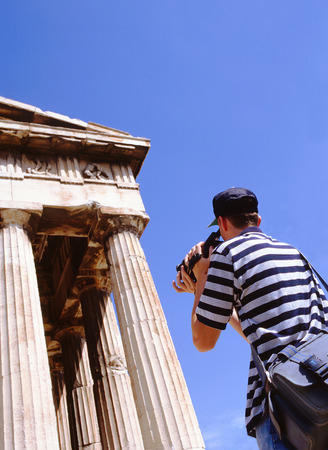 ATHENS,GREECE-JULY 14,2013: Tourist taking photo of the Hephaisteion at the Kolonos Agoraios in the Agoraのeditorial素材