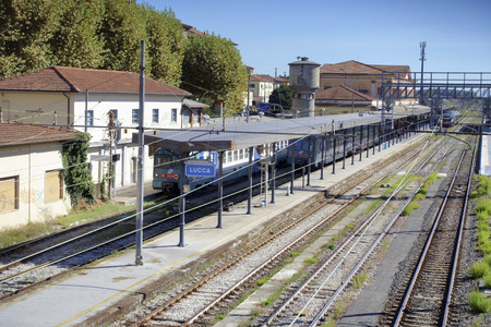 Tracks and trains at the old trainstation of Lucca, Tuscany, Italyのeditorial素材