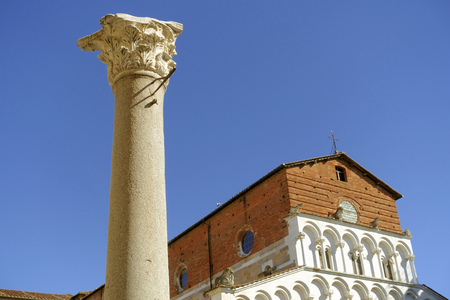The Santa Maria Forisportam church in Lucca, Italy. This is a fine example of Pisan Romanesque with the essentially linear facade in Marble with arcading and loggias.のeditorial素材