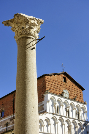 The Santa Maria Forisportam church in Lucca, Italy. This is a fine example of Pisan Romanesque with the essentially linear facade in Marble with arcading and loggias.のeditorial素材