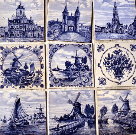 Close up or typical old tin glazed blue Delft wall tilesの写真素材
