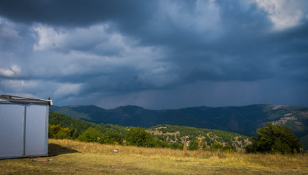 Storm clouds over the mountains in the evening. Macedonia, Carpathiansの写真素材