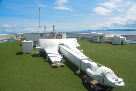 Fishing boat on the deck of a cruise ship in the seaの写真素材