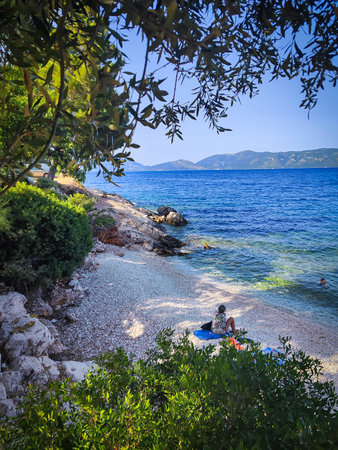 People relax on the beach in Kefalonia, Greeceの写真素材