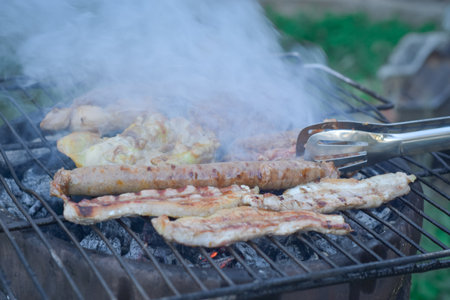 barbecue with delicious grilled meat on grill, closeup of photo