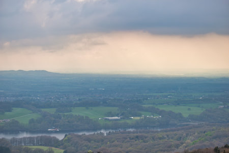 A view from the top of a hill to the valley and a lake in Rivington, Lancashire, UKの写真素材