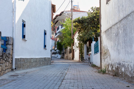 Typical street in the old town in pefkochori, greeceの写真素材