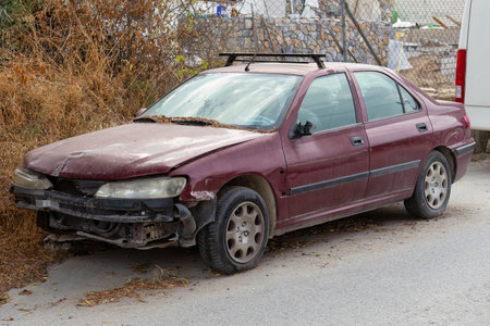 Old car after a car accident on the road. Side view.の写真素材
