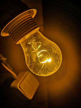 A simple light bulb. Beautiful light. In detailの写真素材