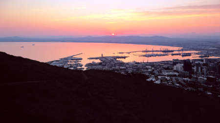Aerial, drone view of sunrise over Table Bay and Cape Town Harbor in  South Africa.の写真素材