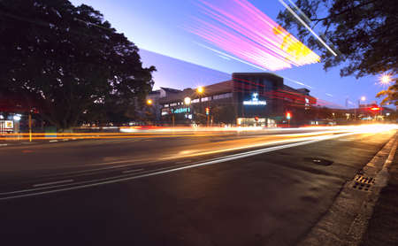 Long exposure of morning traffic passing the newly restored Rondebosch Fountain in Cape Town,...