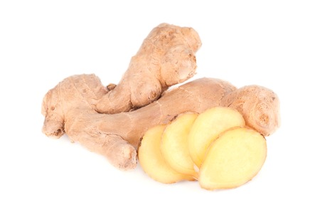 Slice of fresh ginger isolated on white background. Close up