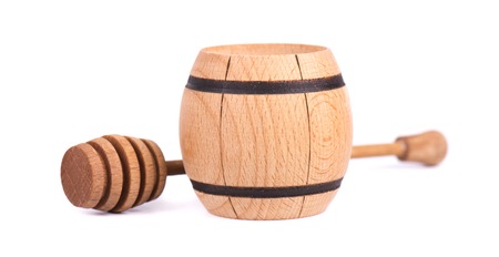 Honey stick and jar wooden, isolated on white backgroundの写真素材