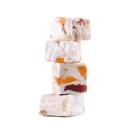 Nut nougat with dried fruit, sweet candy isolated on white background.の写真素材