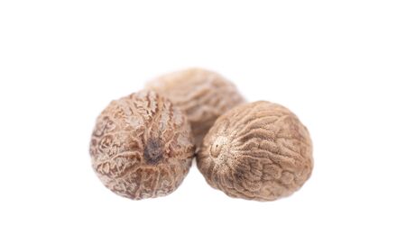 Nutmeg isolated on white background. Two dry whole nutmeg. Clipping path