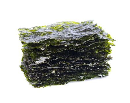 Crispy nori seaweed isolated on white background. Japanese food nori. Dry seaweed sheets.の写真素材