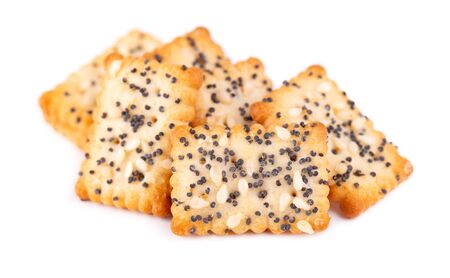 Square poppy seeds and sesame crackers isolated on white background. Dry cracker cookies isolated. Salty snacks isolatedの写真素材