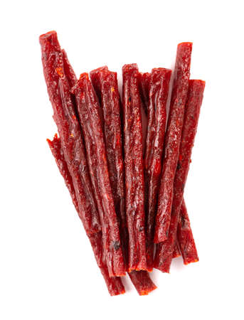 Dry salmon sticks isolated on white background. Dried fish snacks for beer. Top view.