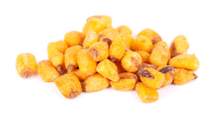 Roasted salted corn nuts isolated on white background. Beer snack, dry corn with spices.の写真素材