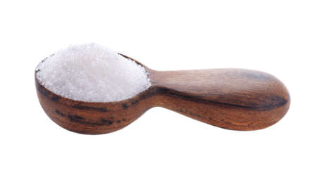 Granulated sugar in wooden spoon, isolated on white background. White sugar.の写真素材