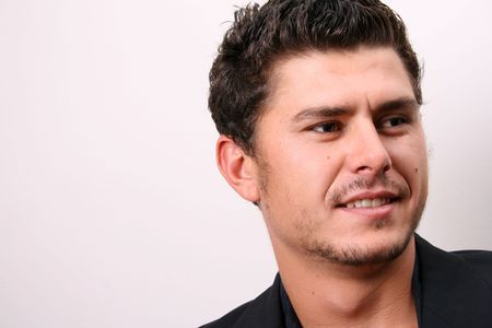 Male model in studio against white wall