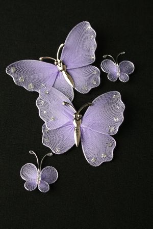 Purple decorative butterflies on a black backgroundの写真素材