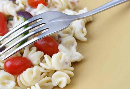 Cold Pasta Salad with tomatoes, cucumbers and olivesの写真素材