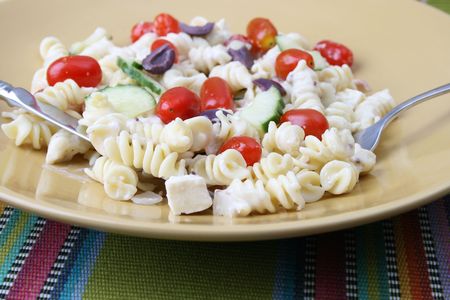Cold Pasta Salad with tomatoes, cucumbers and olivesの写真素材