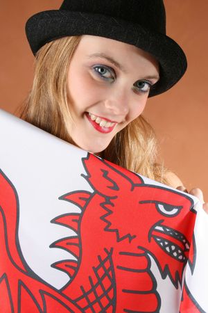 Beautiful young female model with a flag of Walesの写真素材