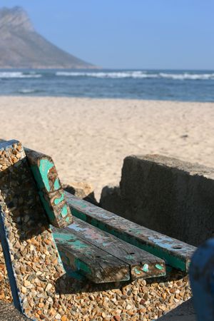 Old worn bench near the sea. FOCUS on the seatの写真素材