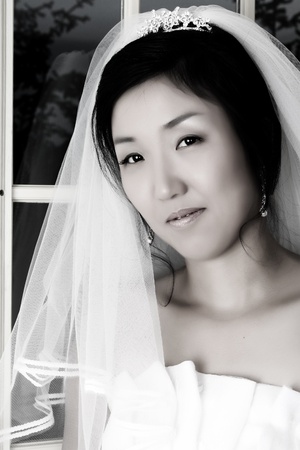 Beautiful Korean bride wearing a traditional wedding gownの写真素材
