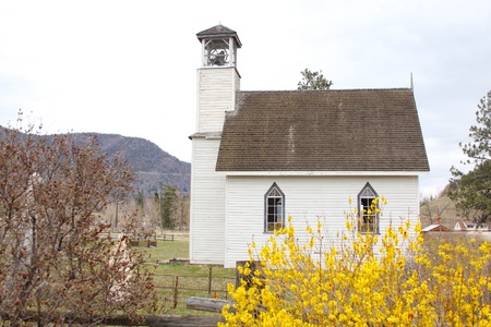Old wooden church surrounded by small cemetry